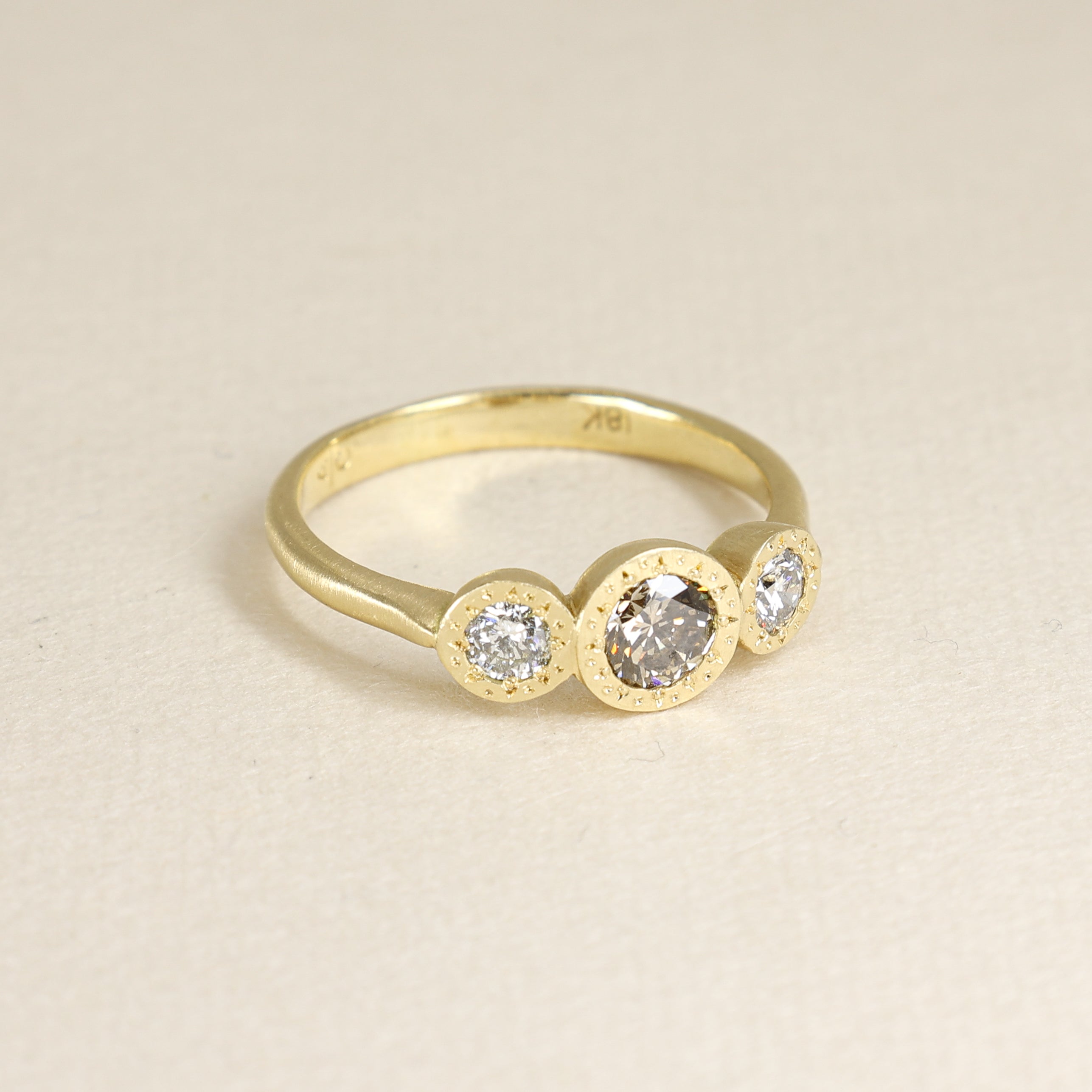 Champagne Engraved Bezel Three Stone Ring