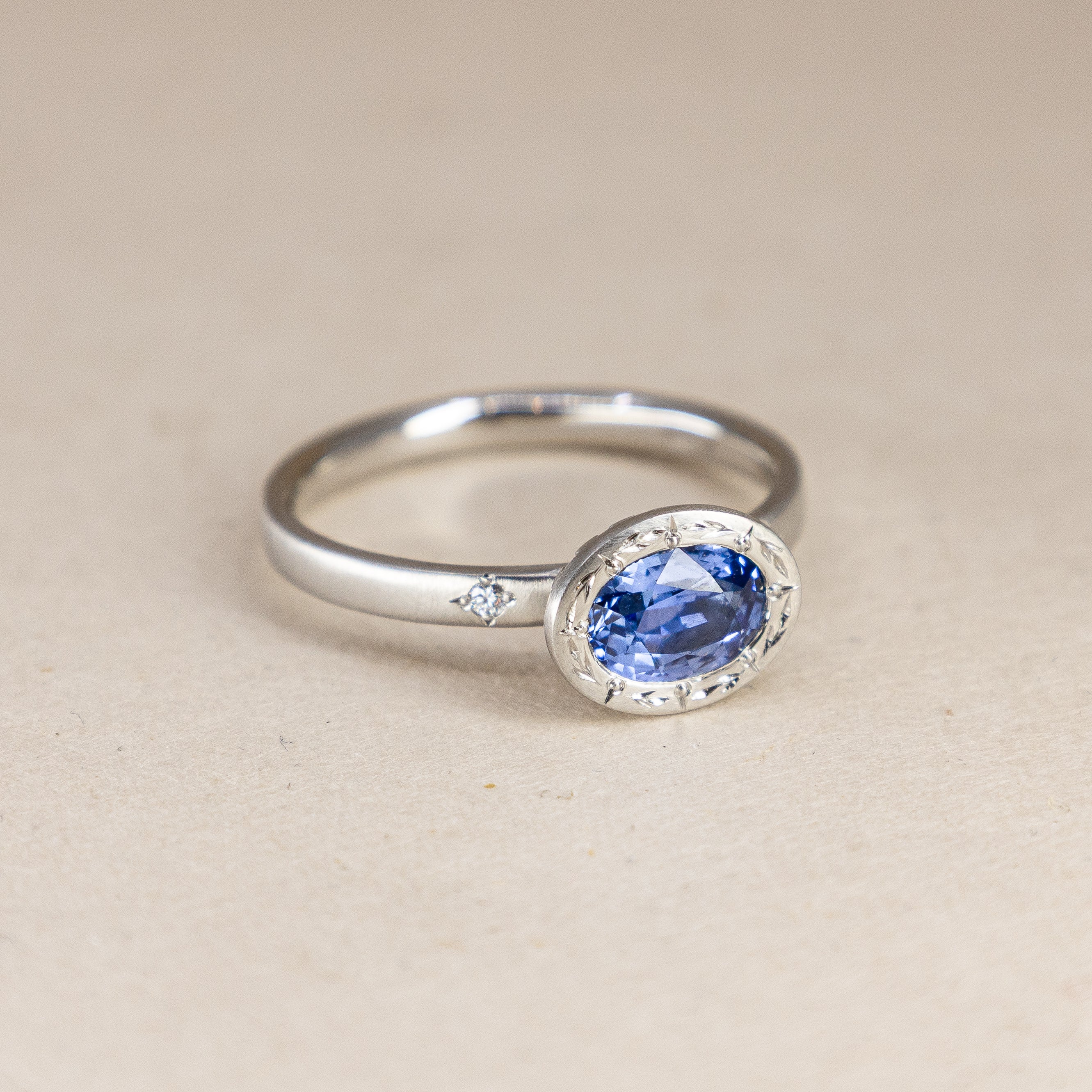 Platinum Engraved Bezel Sapphire Ring