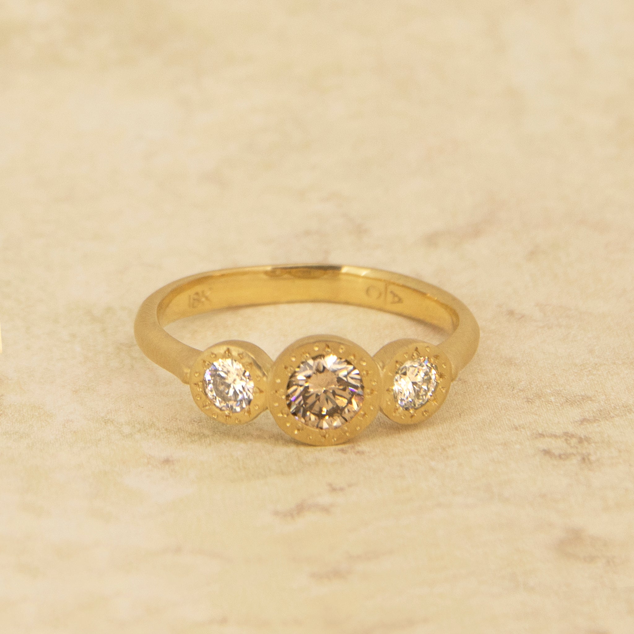 Champagne Engraved Bezel Three Stone Ring