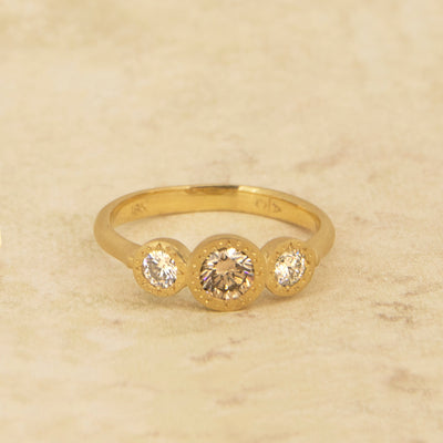 Champagne Engraved Bezel Three Stone Ring